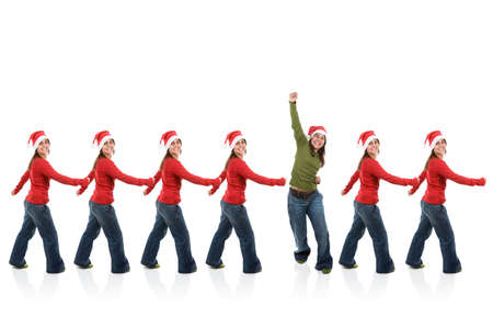 group of santa claus women in line with one breaking the pattern and jumping in happiness. isolated on white background.の写真素材