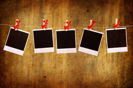 Photo frames with christmas ornaments over grunge backgroundの写真素材