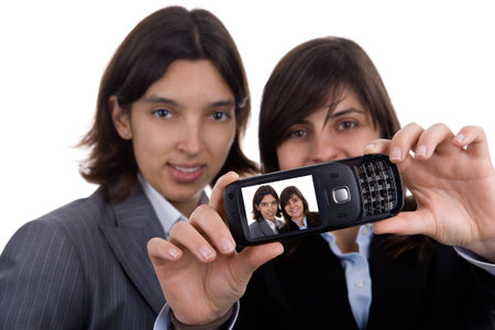 businesswoman talking selfportrait with mobile phone isolated on white