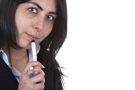 young beautiful businesswoman holding pen isolated on white backgroundの写真素材
