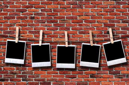 grunge brick wall background with photo frames - landscape orientationの写真素材
