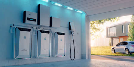 Concept of a home battery energy storage located in a garage with a sunny background with lawn car, family house and big city. 3d rendering.の写真素材