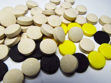 colored pills on a white backgroundの写真素材