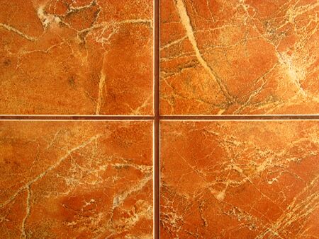 Brown ceramic floor with a pattern. The texture of the ceramic tile.の写真素材