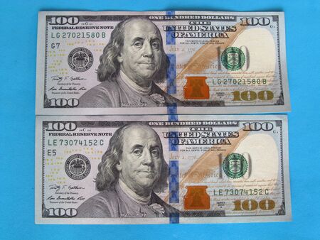 Two hundred dollar notes. All on blue backgroundの写真素材