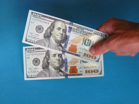 Two hundred dollar notes. All on blue background