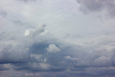 Dark heavy clouds. Rain clouds. Time before the rain. There are bright gaps behind the clouds....