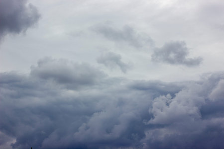 Dark heavy clouds. Rain clouds. Time before the rain. There are bright gaps behind the clouds....