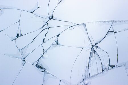 Broken glass background. Cracked glass. Shot in the window.の写真素材