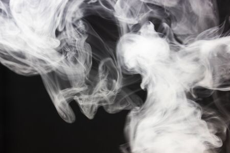 White smoke black background. Weap steam. Fog concept on dark.の写真素材