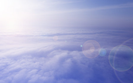 Morning sunrise over clouds, bright light and lens flare. Thick and beautiful clouds, aerial...