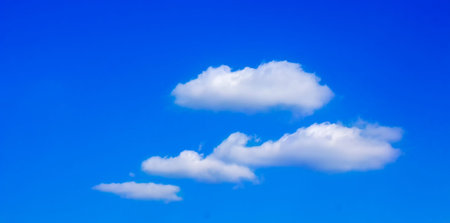 White clouds on a background of blue sky. Cloudy sunny day.