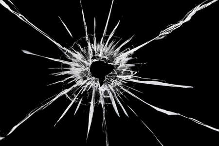 The texture of cracks on the glass with the effect of a shot at the window.の写真素材