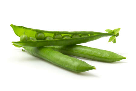 Isolated green pea pods on a white background. Beans in an open podの写真素材