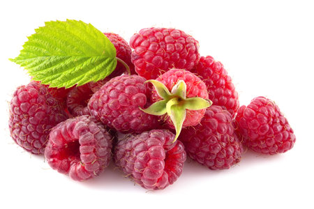 Fresh raspberries and green leaf isolated on white background