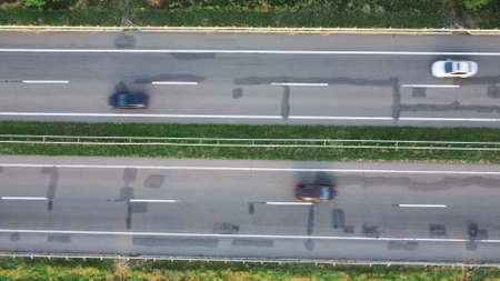 Cars are blurred in motion. Top view of a cracked highway.の写真素材