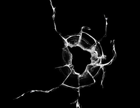 cracks on black glass background, broken abstract glass hole destruction concept.の写真素材