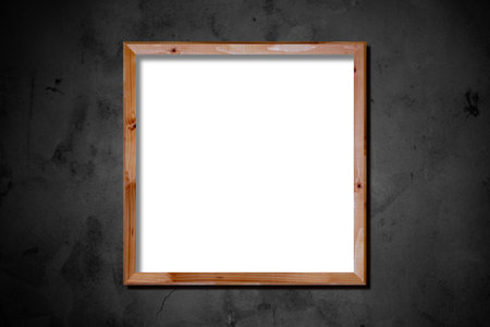 Blank wooden picture frame on grunge cement wall background with space for your textの写真素材