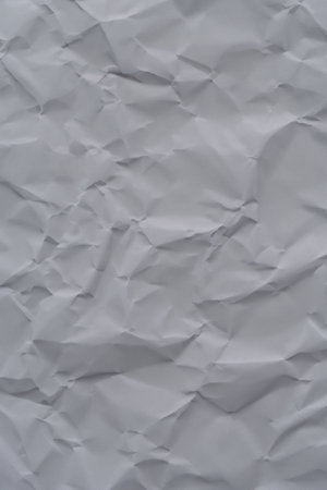 This crumpled paper's texture evokes a sense of depth and visual interestの素材