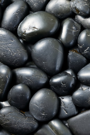 The deep, ebony hues of the stones create a sense of depth and mysteryの素材