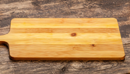 Wooden kitchen board on a wooden tableの素材