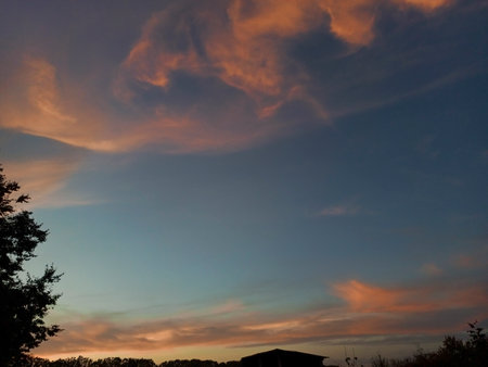 Beautiful blurred clouds in the blue sky of an evening sunset on the horizonの写真素材