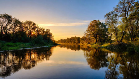 The last rays of the sunset sparkle on the water of the river in autumn.の素材