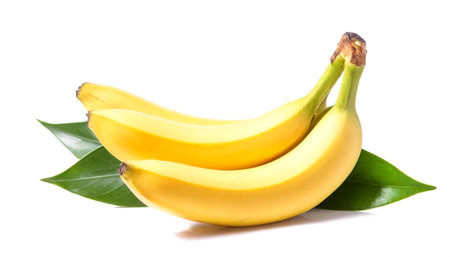 Bunch of bananas with green leaves isolated on a white backgroundの素材