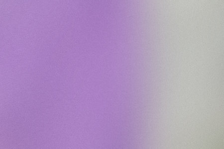 Calming gradient transitioning from purple to white with a delicate grainy textureの写真素材