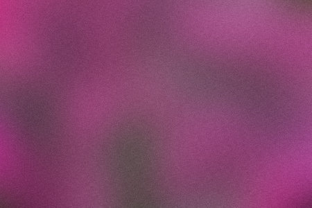 Vibrant grainy texture background in shades of pink and purpleの写真素材