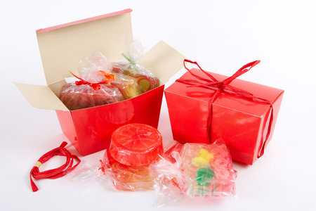 Many   handmade  soap in a red gift box on a white background