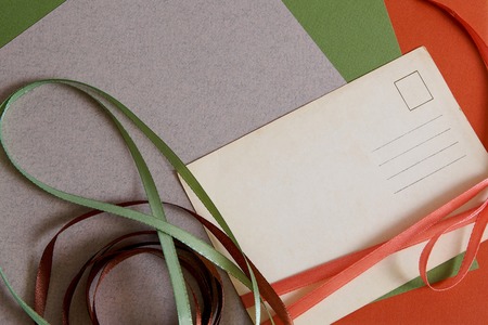 Retro vintage  background with colorful ribbons and old paperの写真素材