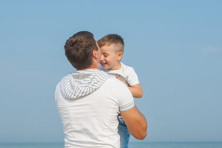 Happy family. Father and child having fun on the beach. Positive human emotions, feelings.の写真素材