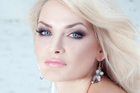 Beauty woman outdoors. Beautiful adult Model with long hair. Elegant Woman.の写真素材