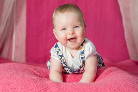 Portrait  little cheerful child laugh. Happy sweet cute face.の写真素材