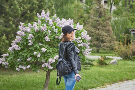 Happy Beautiful Fashion girl Walk in the city park, wonderful moodの写真素材