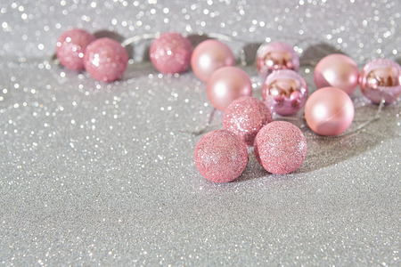 Christmas balls pink on bokeh gray backgroundの写真素材