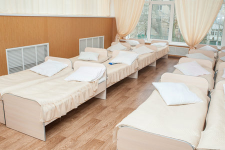 Furniture for children preschoolers. Sleeping room in kindergarten. Beds for small children