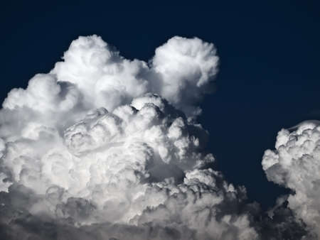 Towering detailed cumulus cloud with lenticular formationsの写真素材