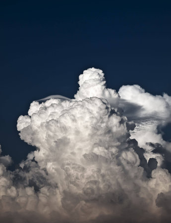 Towering detailed cumulus cloud with lenticular formationsの写真素材