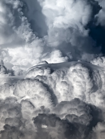 Towering detailed cumulus cloud with lenticular formationsの写真素材
