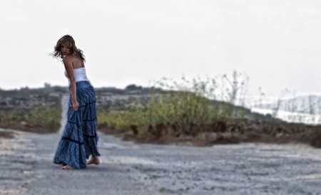 Beautiful female model in a dilapidated urban settingの写真素材