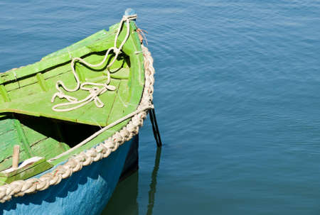 An old and battered boat in the fishing village of Marsaxlokkの写真素材