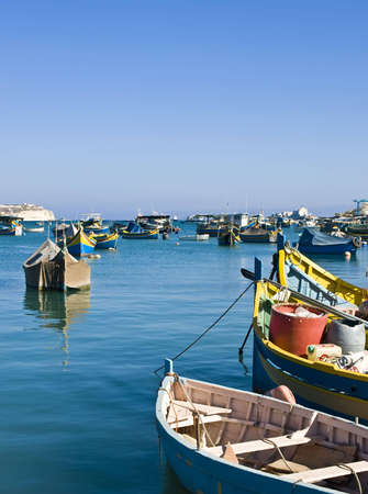 Traditional fishing boats of Malta in the fishing village of Marsaxlokkの写真素材