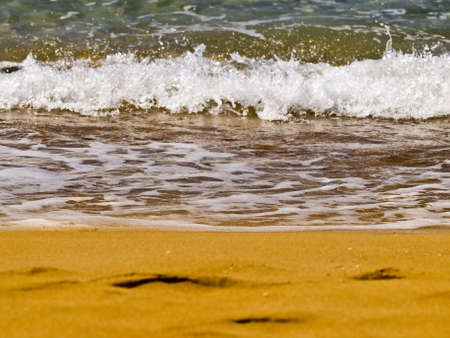 Waves crashing on the coast on a beach in Maltaの写真素材