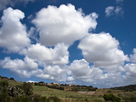 Beautiful sky and clouds over typical valley in Maltaの写真素材