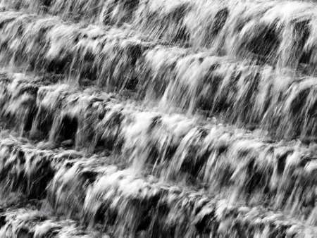 Water flowing down a terraced wall in Chadwick Lakes in Maltaの写真素材
