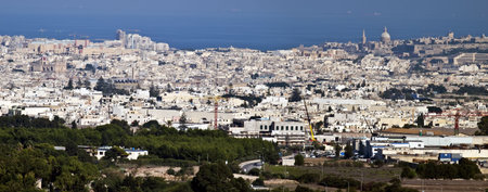 View of Malta as seen from Mdina bastions with plane on final descent to Luqa Airportの写真素材