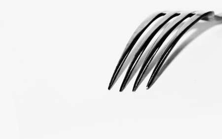 Dining fork over white backdropの写真素材