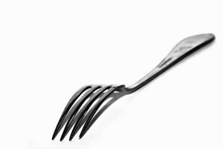 Dining fork over white backdropの写真素材